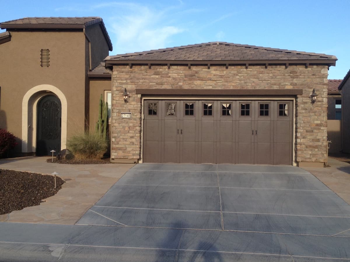 Double garage door on a modern house with stone accents